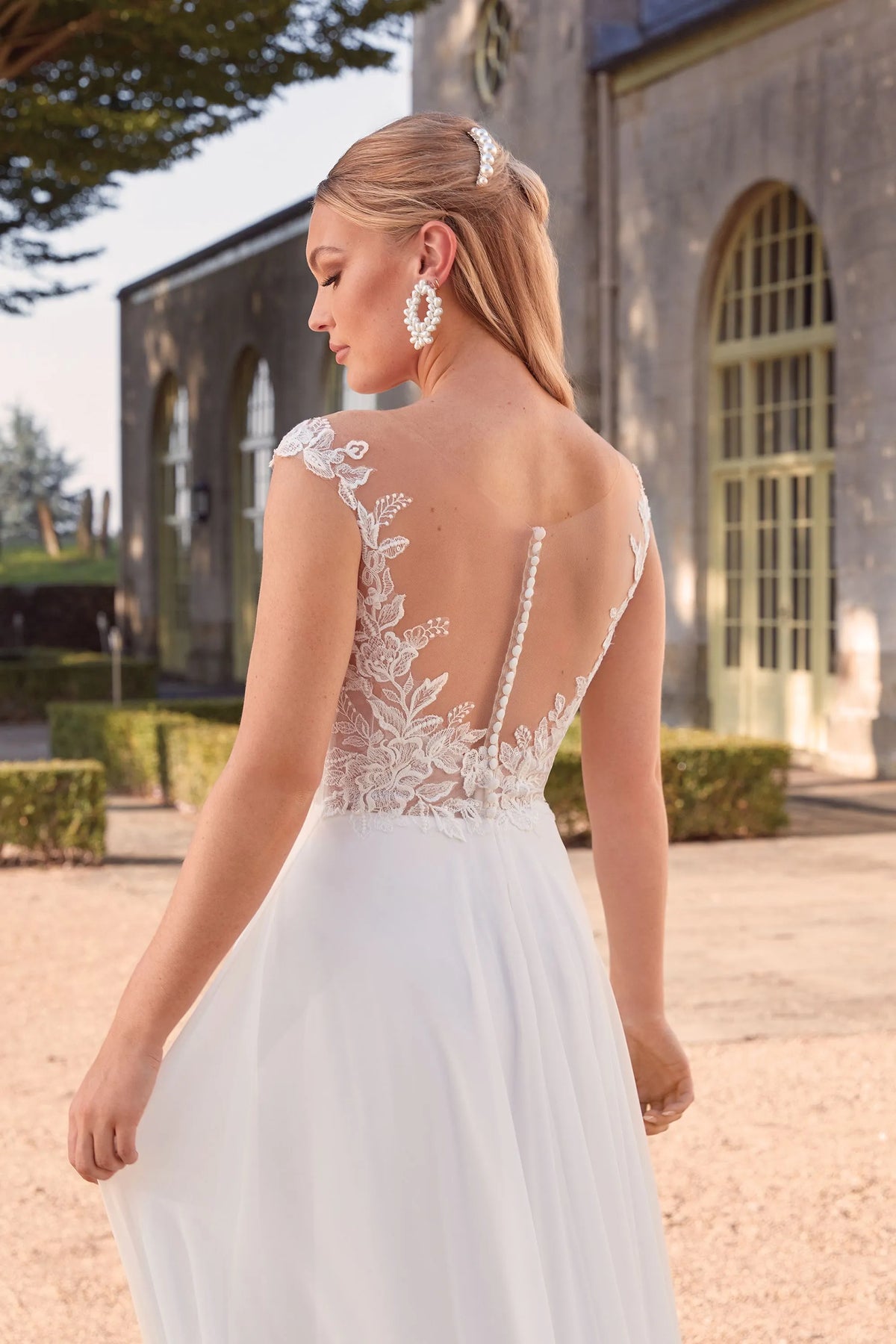 XAYWEAR chiffon wedding dress with lace back and cap sleeves flowing skirt outdoor setting