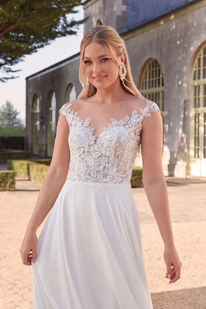 XAYWEAR chiffon wedding dress with lace bodice and flowing skirt worn by bride outdoors