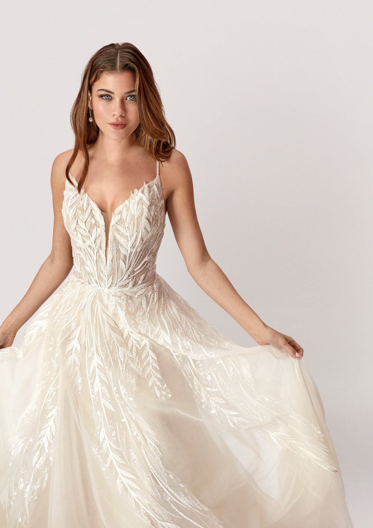 XAYWEAR elegant white wedding dress gown with intricate leaf pattern and flowing skirt