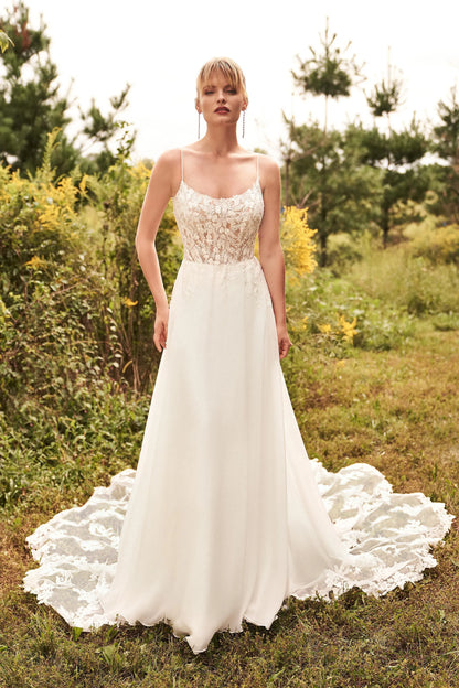 XAYWEAR luxury wedding dress with lace bodice and flowing skirt outdoors in natural setting