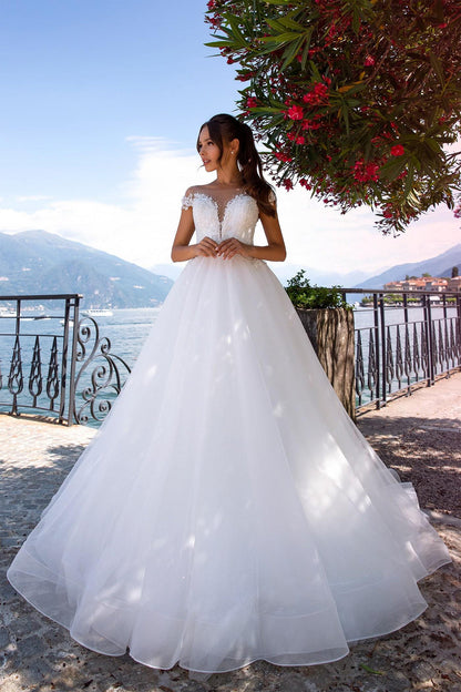 XAYWEAR elegant ballgown wedding dress with lace bodice and full tulle skirt by the lake