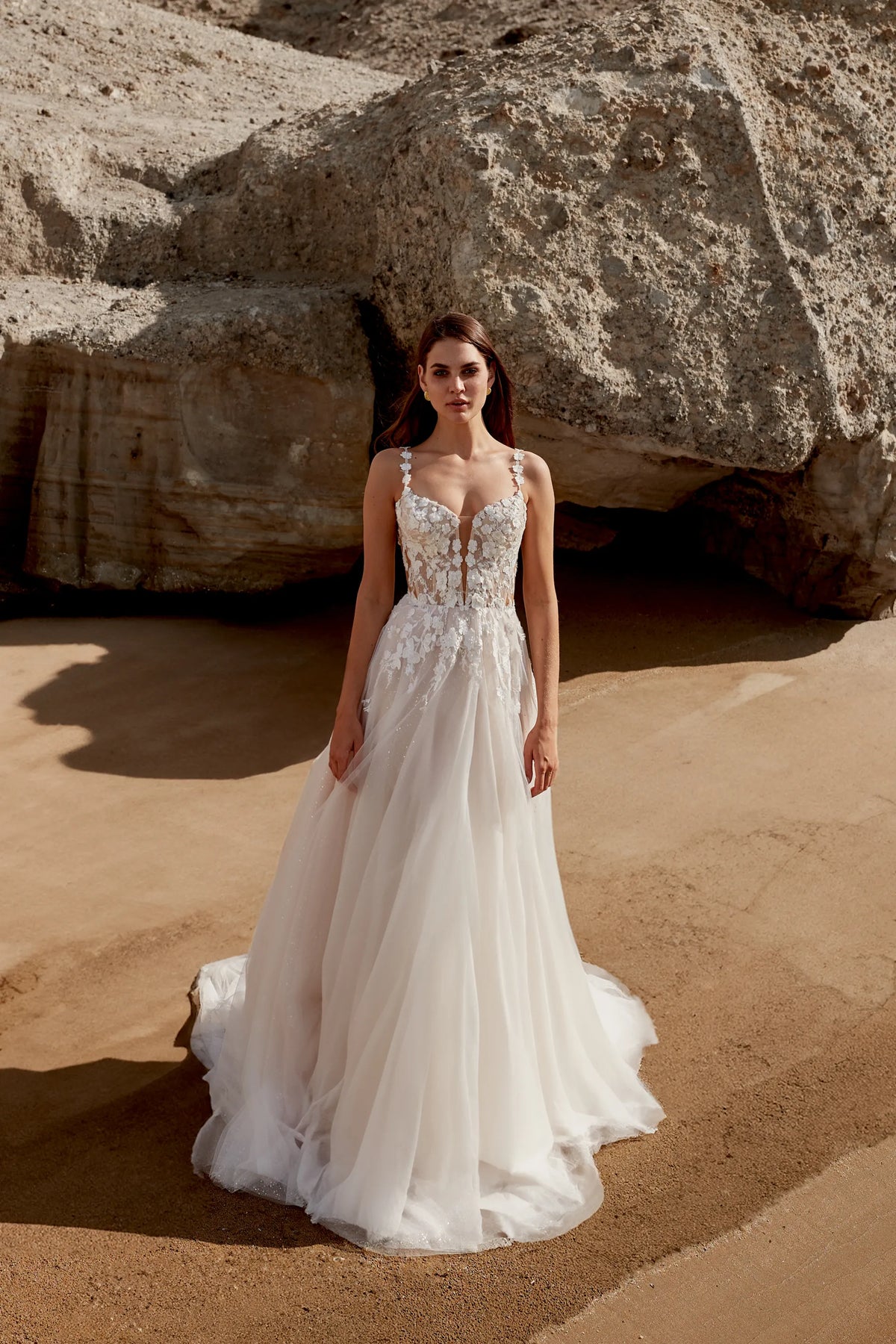 XAYWEAR elegant wedding dress with floral lace bodice and flowing tulle skirt worn by model outdoors