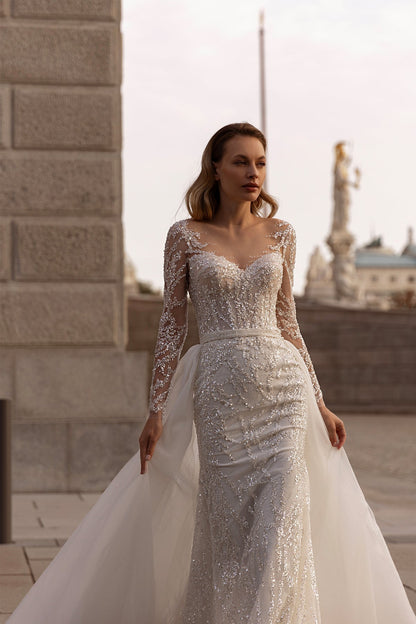XAYWEAR wedding dress with long lace sleeves and intricate beading on fitted gown with tulle train