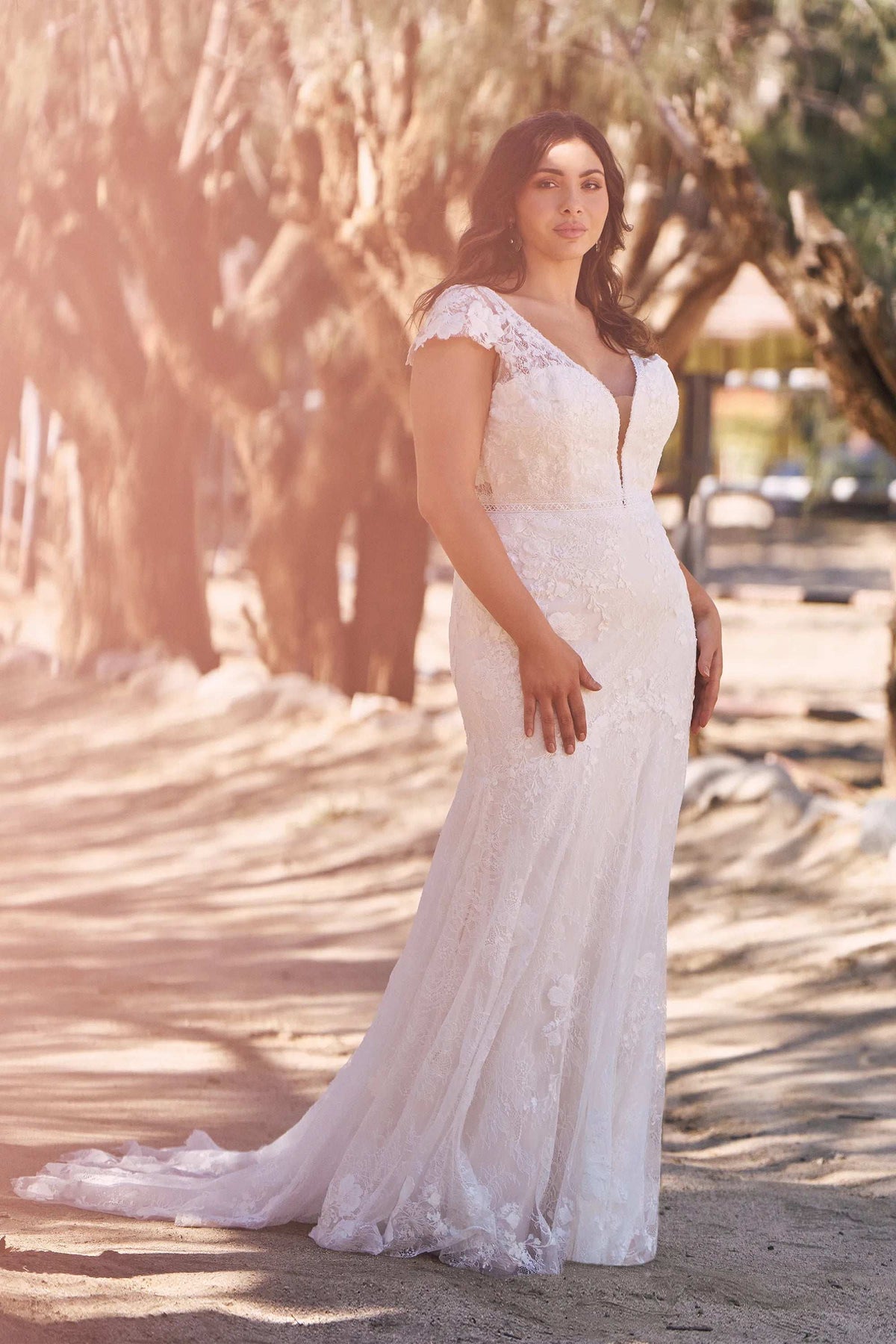 XAYWEAR elegant wedding gown with lace sleeves and fitted bodice worn outdoors