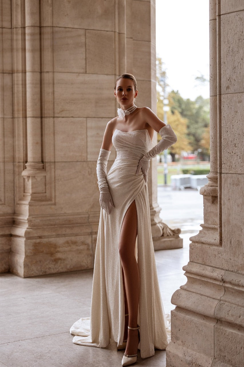 Elegant XAYWEAR wedding gown with thigh-high slit and strapless design styled with long gloves
