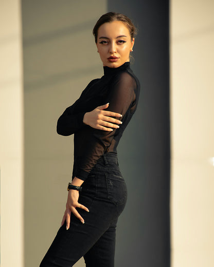 XAYWEAR women black top with sheer long sleeves styled with black high-waisted pants